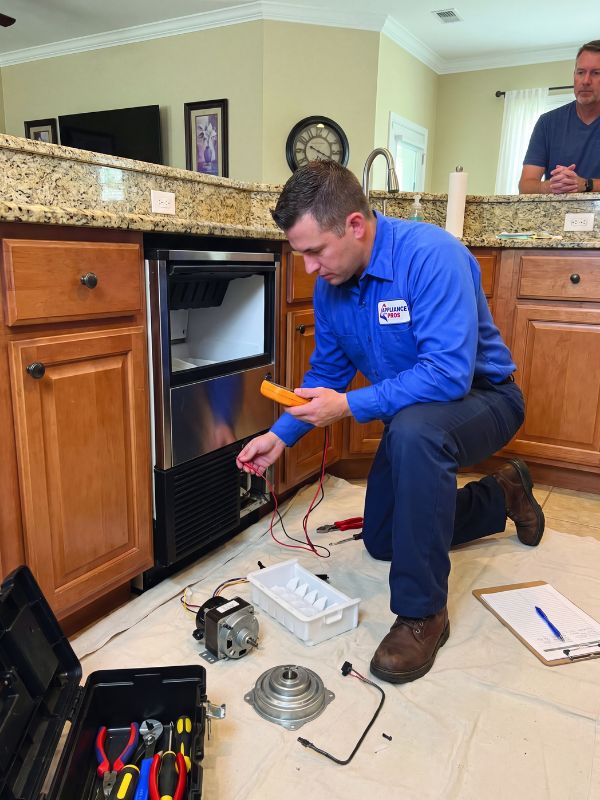 Round Rock technician diagnosing a refrigerator ice maker — no-ice, slow production, and dispenser fault repair in Texas
